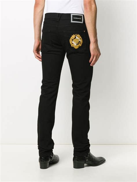 versace jeans maglietta nera con medusa|Jeans vestibilità slim ricamati Medusa .